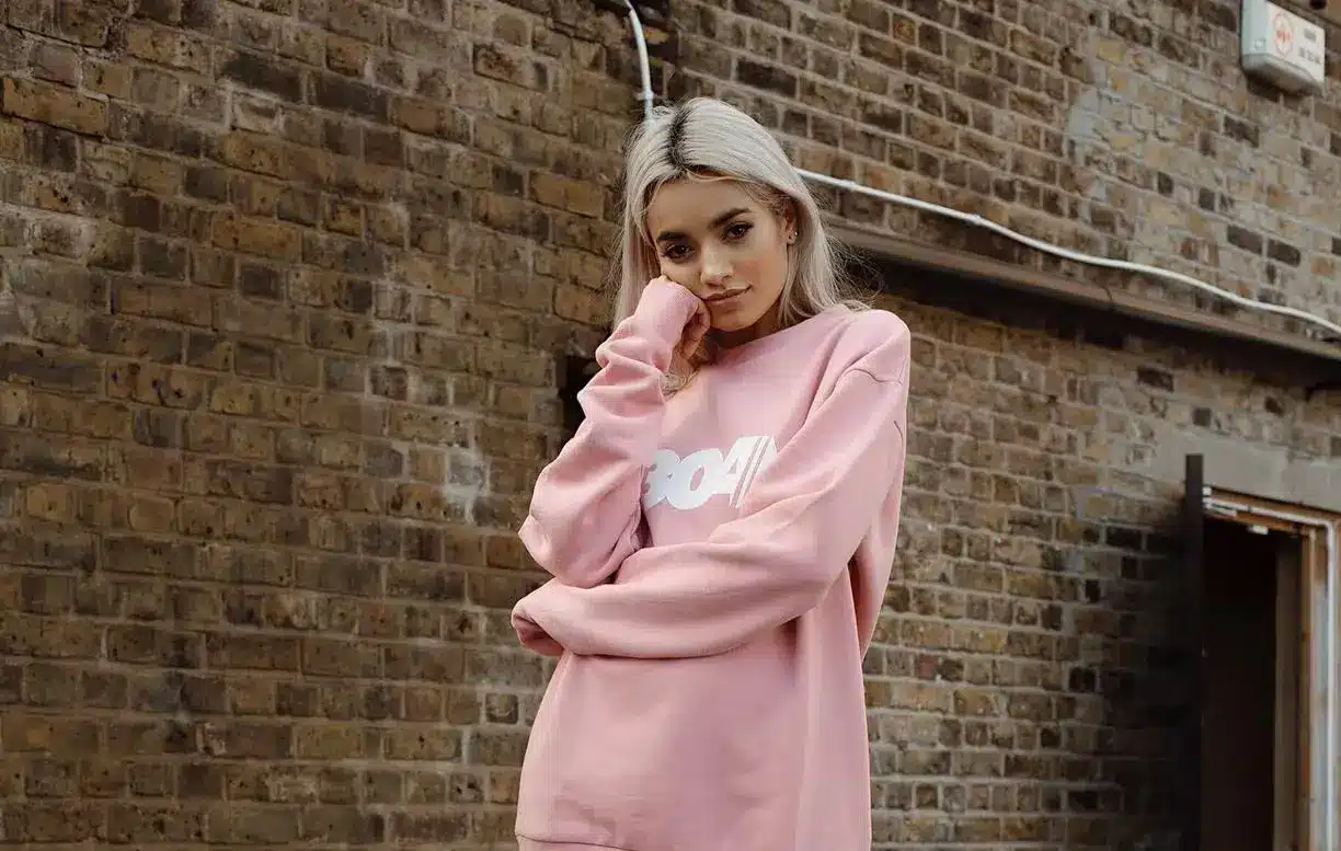 women wearing pink jumper