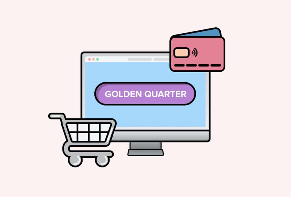 Golden Quarter" written on a laptop screen, with shopping cart and credit card beside the screen
